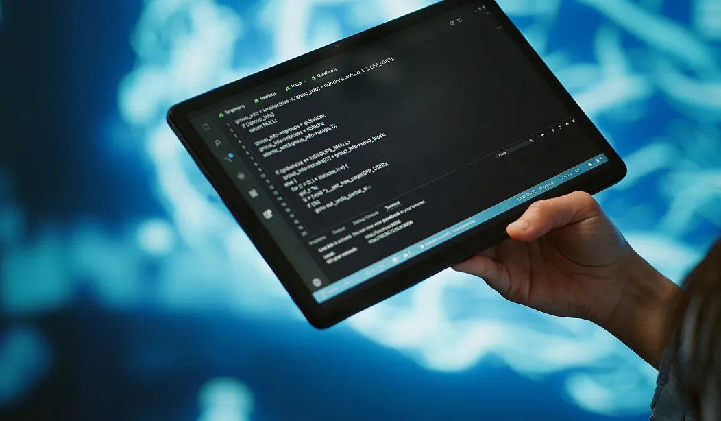 resized-close-up-it-professional-using-tablet-building-ai-algorithms-2